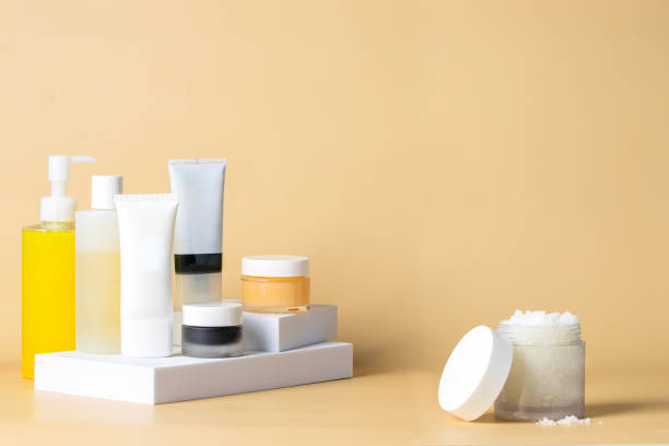 istock Skincare routine and exfoliante step, salt scrub glass jar on beige background. 1966132130