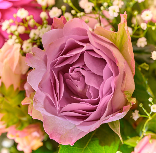 A bouquet of flowers on a dinning table in the livingroom