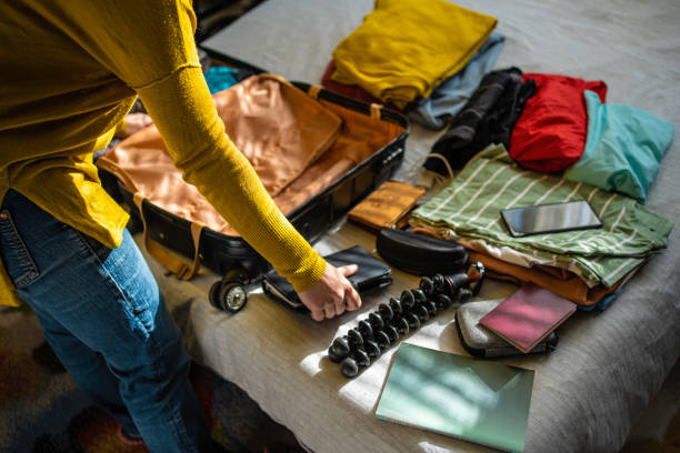 istock Travel time. Preparing suitcase for a trip. 1966139083
