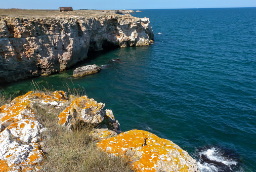 Steep coast with karst caves and grottoes near the village of Tyulenovo, Black Sea Bulgary