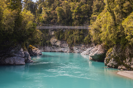 Swig bridge over the blue water in the hokitika gorge