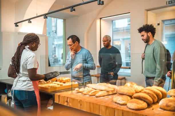 istock Mature Asian Buying  Freshly Baked Goods In A Bakery 1966175528