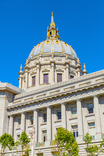Dome of San Francisco City hall rotunda. Travel destination and showplace in San Francisco. Sunny view of the San Francisco City Hall at California, USA. Close-up, bottom view.