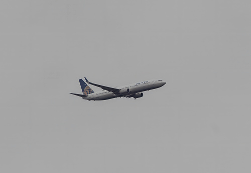 Kissimmee, Florida, USA - 30th December 2023: A United Airlines Boeing 767 climbing after departing Orlando in Florida, USA
