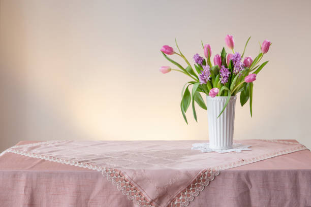 istock spring flowers in white vase in vintage style 1966267952