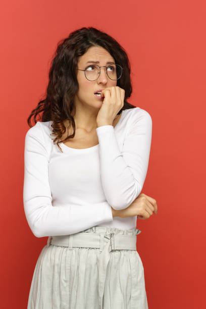 istock Worried female bite nails look up scared wait for interview result, exam. Anxious millennial woman 1966299523