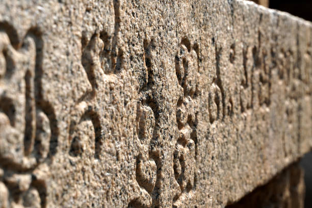 Tamil Inscription in ancient Temple. Inscriptions of Tamil language carved on the stone walls at Kailasanathar temple in Kanchipuram. Indian rock art relief carvings of Historical ancient vintage Tamil text in Temples. tamil temple stock pictures, royalty-free photos & images
