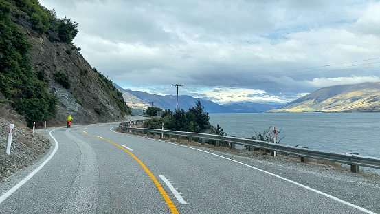 Driving the highway alongside the mountains and the shore of Lake Wakatipu between Queenstown and Glenorchy