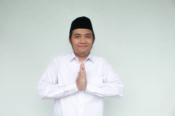 istock Muslim Asian man give greeting during Ramadan celebration. 1966349783