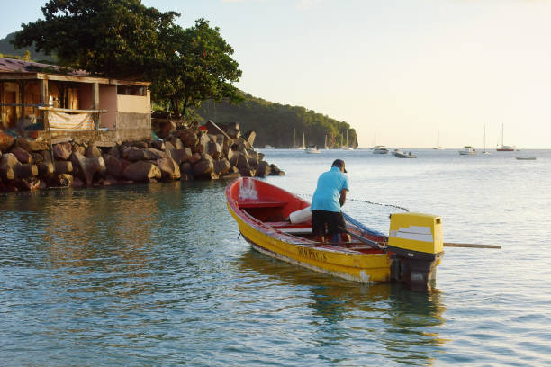 Fisherman pulling fishing net stock photo