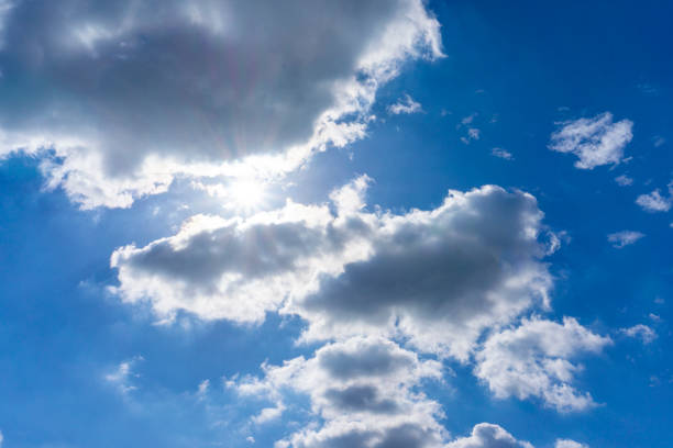 Background material of sun flare and refreshing blue sky and clouds