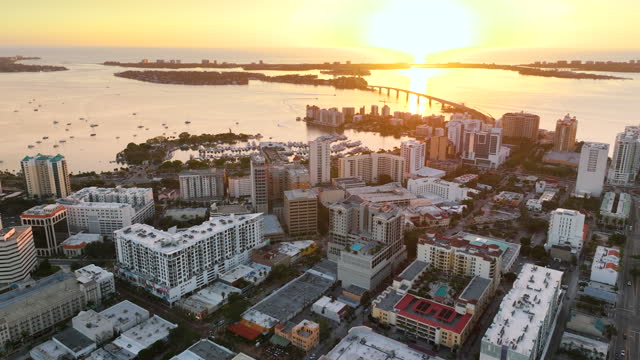 Sarasota, Florida city downtown at sunset with expensive bayfront high-rise buildings. Urban travel destination in the USA.