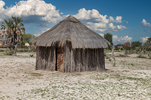 Botswana village rondavel with wood walls and thatched roof typical to southern africa
