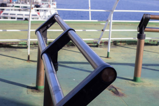 The iron railing on the ship is painted brown