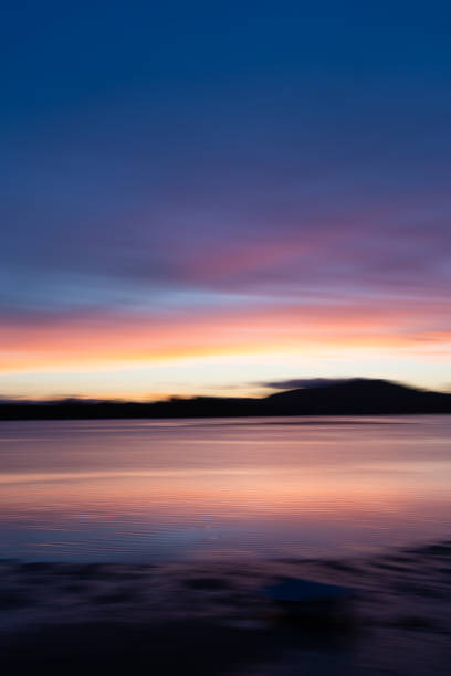 istock Background sunset intentional camera movement effect soft hues on morning light blue hour. 1966482010