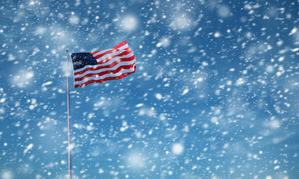 istock Waving American Flag during snow storm 1966497539