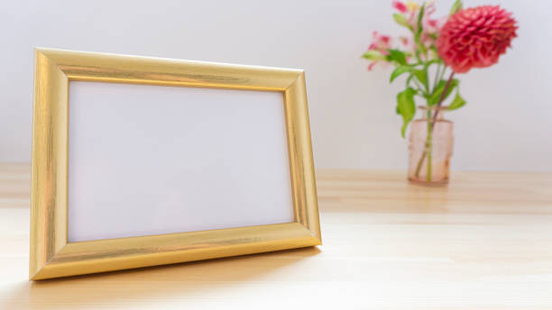 istock Photo frames and flowers on the table 1966510827