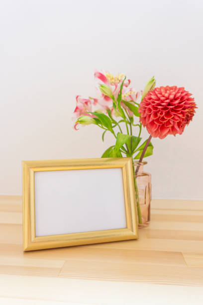 istock Photo frames and flowers on the table 1966510828