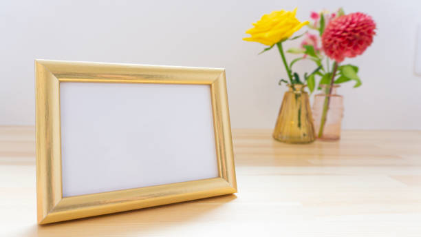 istock Photo frames and flowers on the table 1966514055