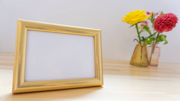 istock Photo frames and flowers on the table 1966515052