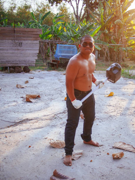 istock brown man carry heavy hammer 1966549225