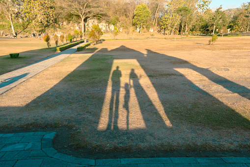shadow of three people, father, mother and son in   Ratu Boko Temple, Yogyakarta