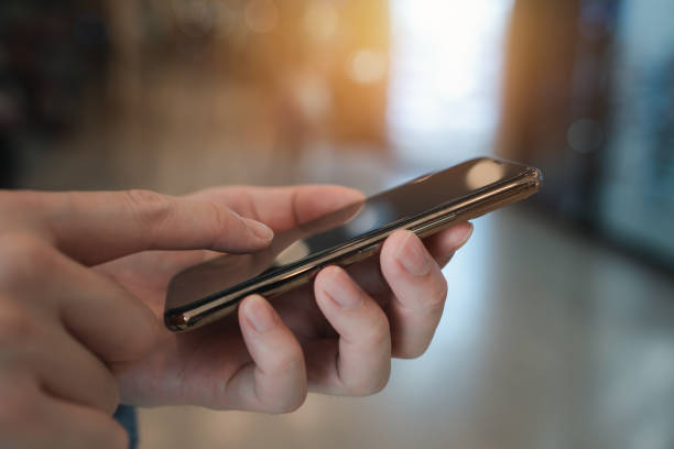istock Person using smartphone. Technology, Communication and Social media content marketing concept. 1966742002