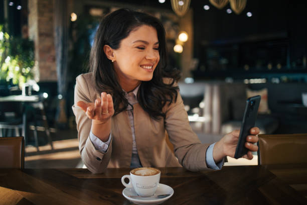 istock Business woman or freelancer in the cafe vlogging. 1966763764