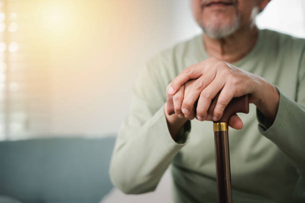 istock Closeup hands of senior disabled man holding walking stick 1966774862