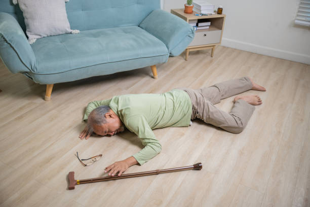 istock Older senior man headache lying on the floor after falling 1966774869