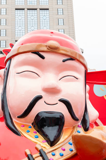 the God of Prosperity statue at vertical composition