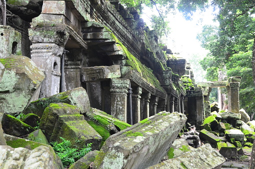 Collapsed stones covered with moss in Angkor
