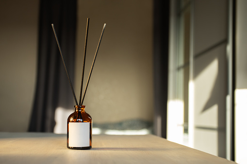 Bedroom interior with aroma diffuser, essential oil bottle, relaxing atmosphere, spa scent