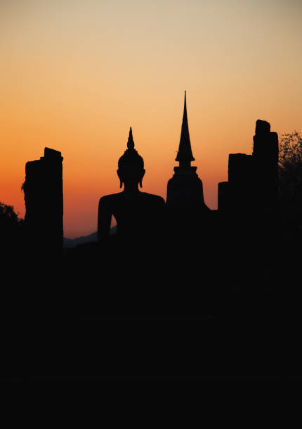 istock Sunset at Wat Mahathat buddha and temple in Sukhothai Historical Park 1966887091