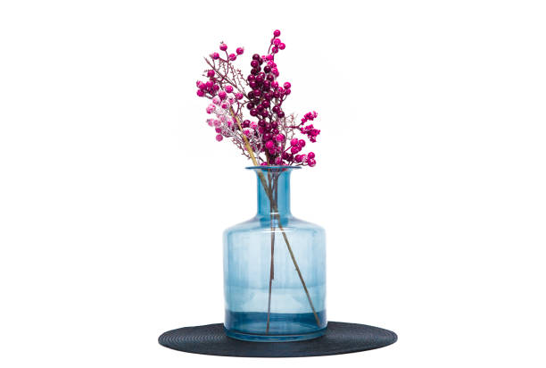Vase with pink flowers isolated on white background