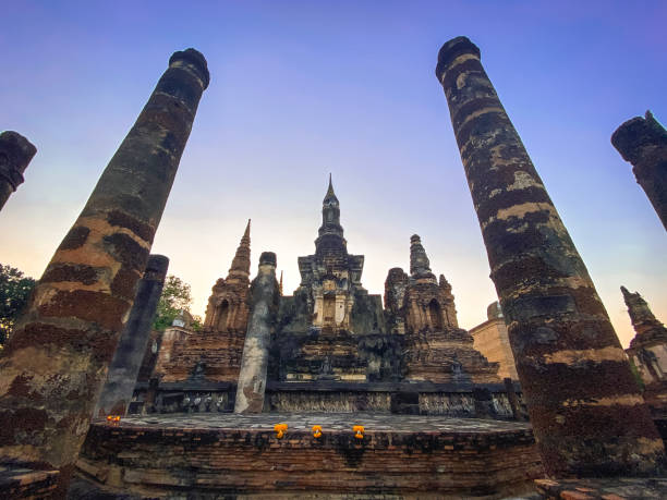 istock Sunset at Wat Mahathat buddha and temple in Sukhothai Historical Park 1966935083