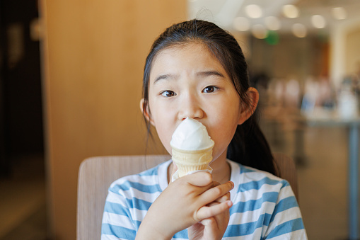 Little Girl Eating Ice Cream