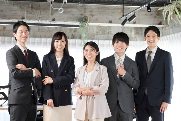 istock Business people lining up with smiles in the office 1966993899