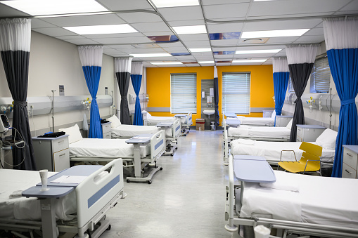 Beds in empty hospital ward