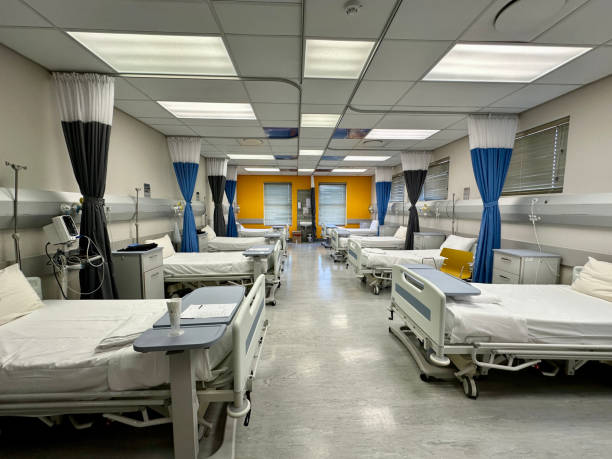 istock Clean and neat beds in empty hospital ward 1967022751