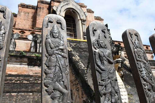 Several guardian metal relief aligned in front of a temple in Chiang mai