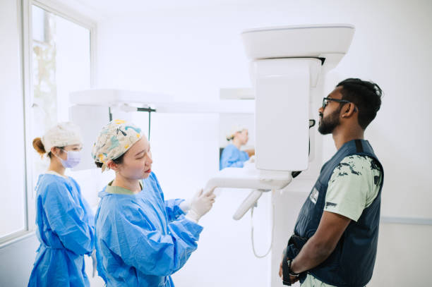 istock Asian Indian patient taking digital 3D panoramic dental x-ray. 1967081748