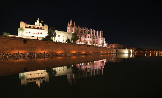 Catedral de Mallorca and Palau Reial de l'Almudaina at night. It is not private property, without access restrictions.