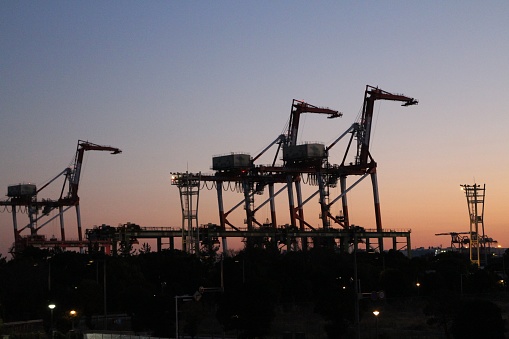Gantry cranes in dusk at Aomi Container Terminal in Tokyo, Japan
