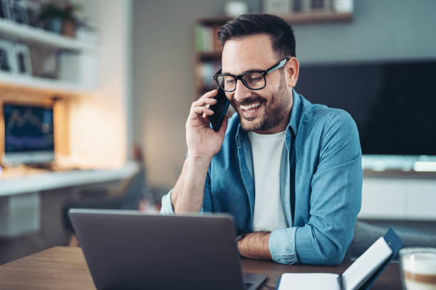 istock Smiling man talking on the phone 1967108667