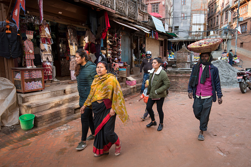 Kathmandu, Nepal- April 20,2023 : Street view of the residents of  Patan Durbar Square in their daily routine.