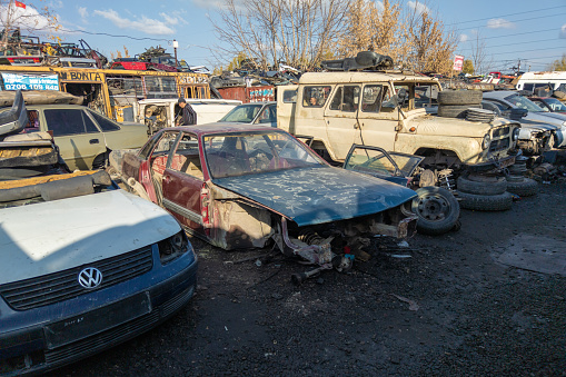 car parts at open air junkyard and used spare parts market in Kudaybergen, Bishkek, Kyrgyzstan - November 5, 2022