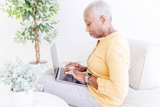 istock Senior Woman With Laptop at Home 1967201312