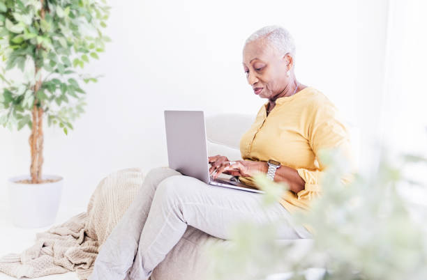 istock Senior Woman With Laptop at Home 1967201314