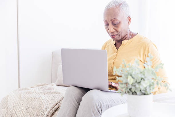 istock Senior Woman With Laptop at Home 1967201321